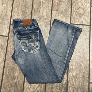Big Star size 29R casey k low rise flare jeans. Dark/Mid wash. Some distressing.